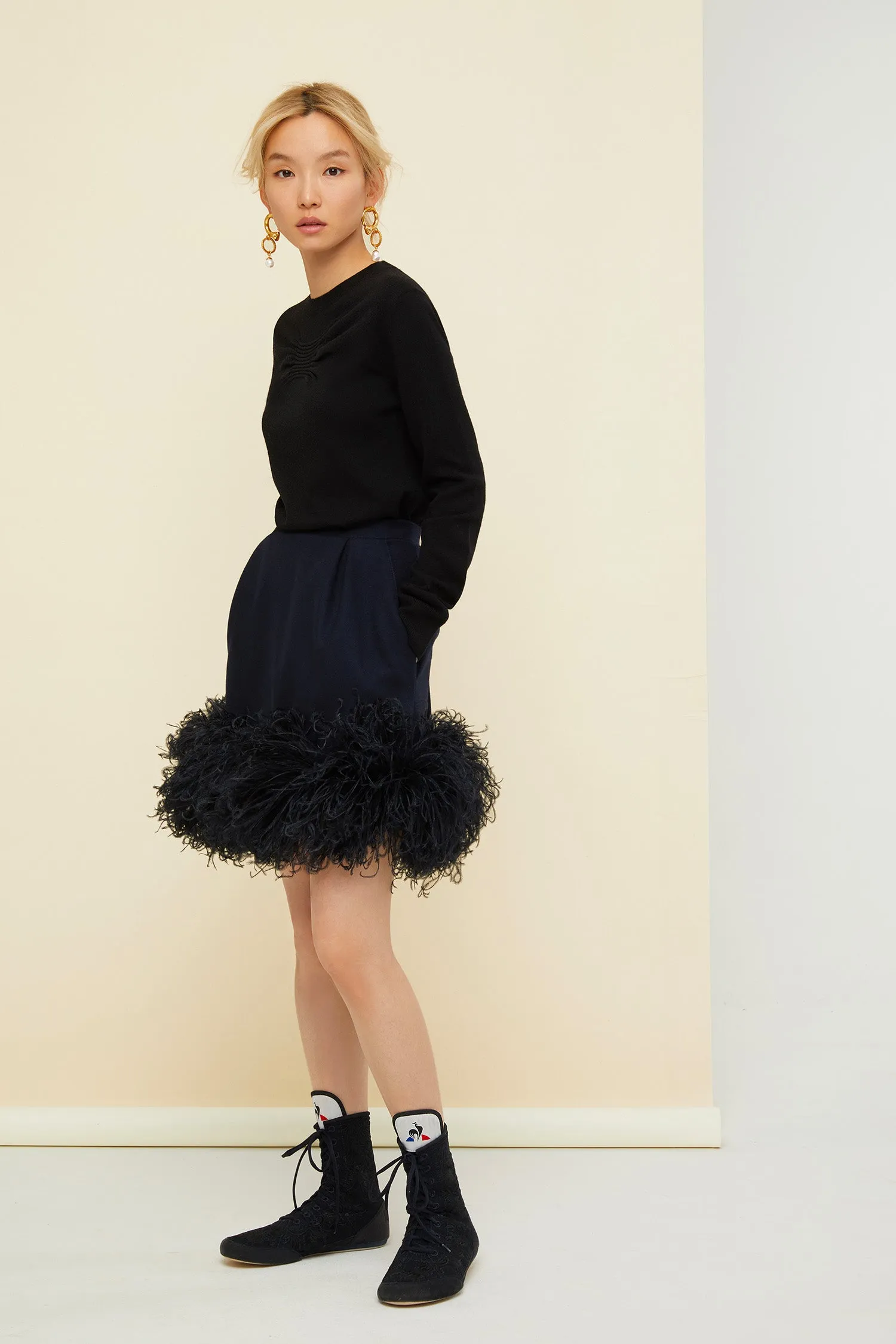 Feather-embellished pleated skirt
