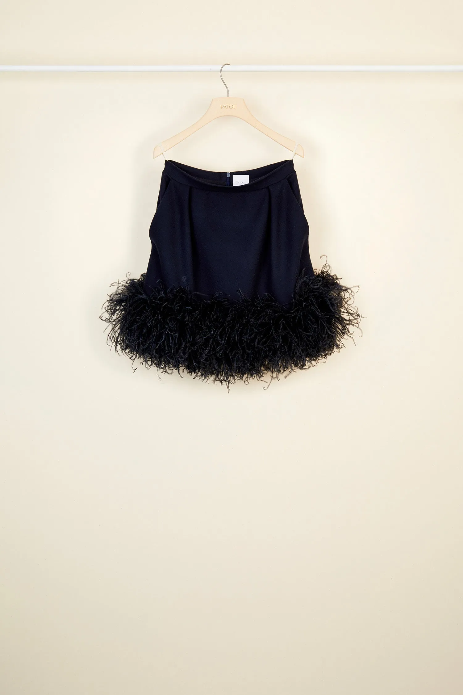 Feather-embellished pleated skirt