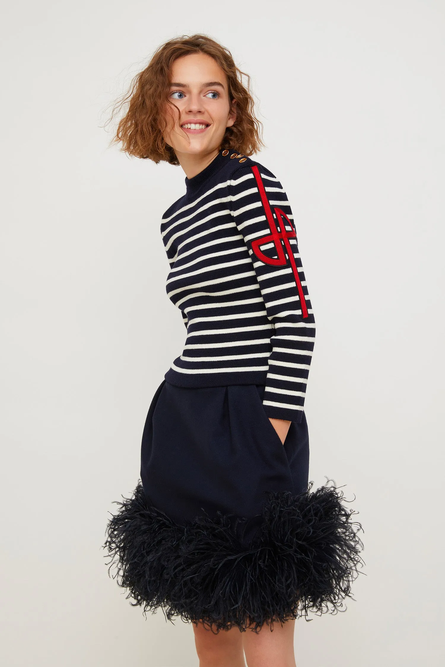Feather-embellished pleated skirt